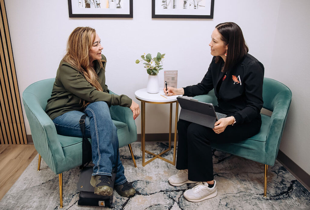 Dr. Kim Westbrook consulting with a patient at Ascent Med Spa