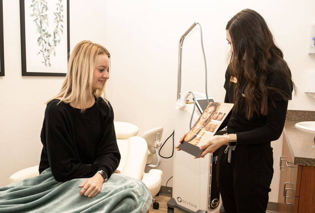 Laser hair removal treatment consultation with patient at Ascent Med Spa