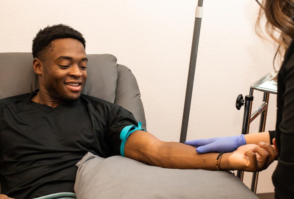 Man getting an IV for IV and vitamin therapy in Laramie, WY