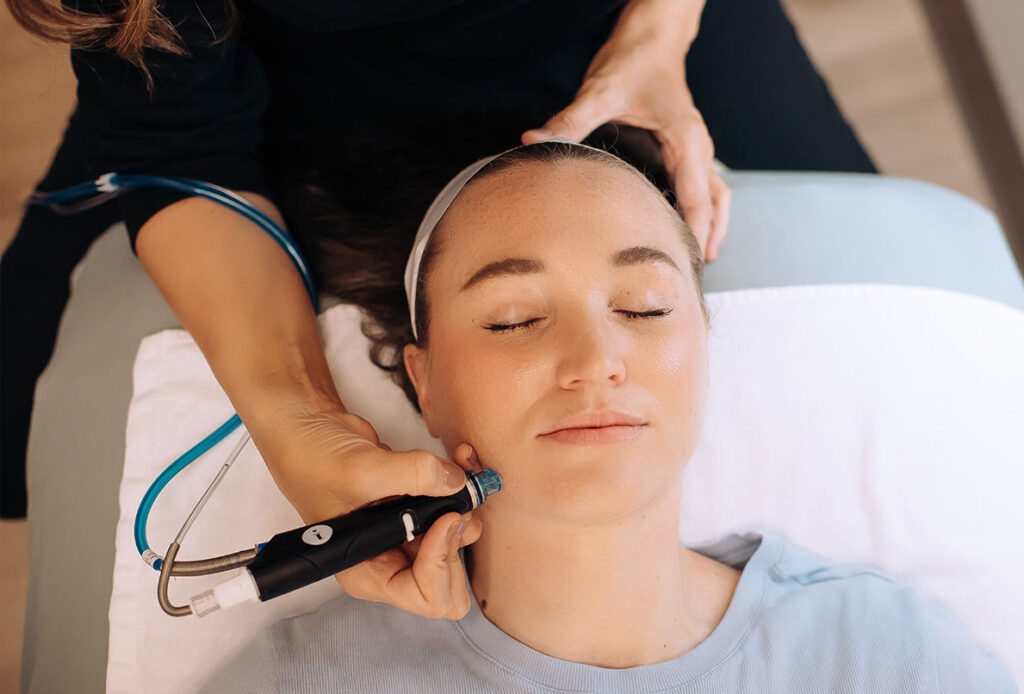 Woman receiving HydraFacial at Ascent Med Spa