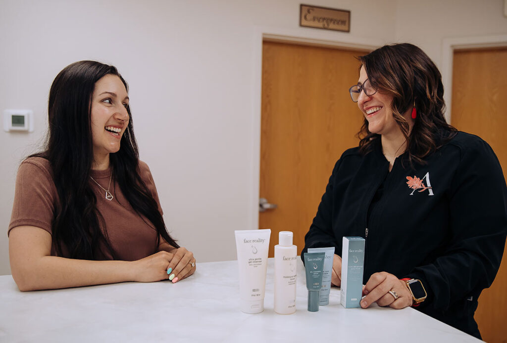 Ascent Med Technician and patient discussing Face Reality products for acne treatment