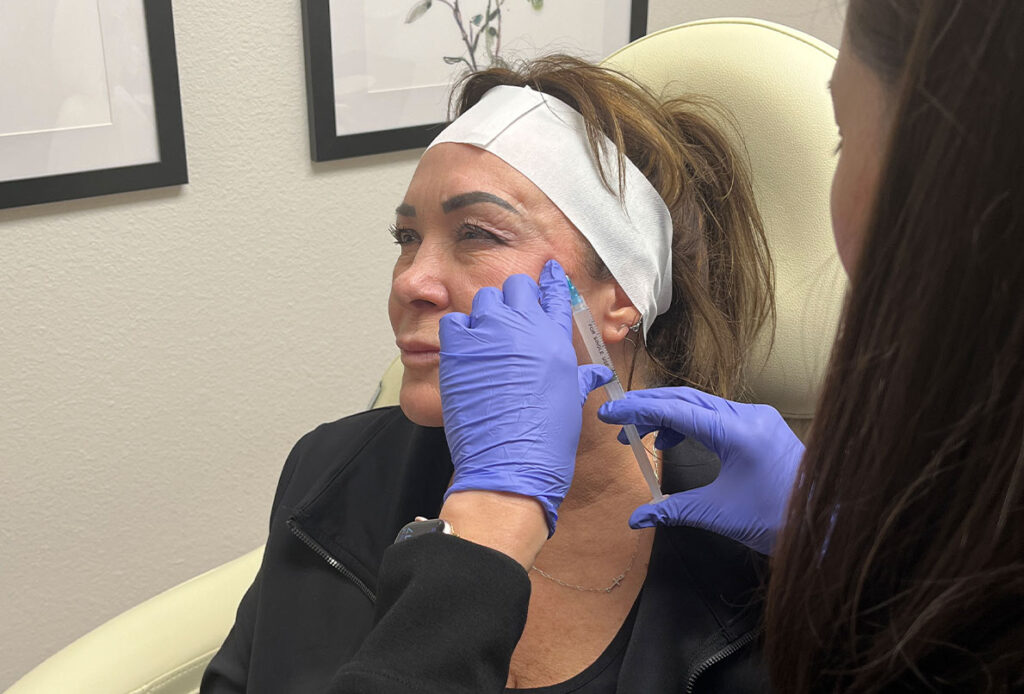 Patient receiving Sculptra injection at Ascent Med Spa